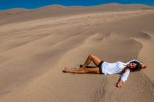 A beautiful woman embracing the great outdoors at the Great Sanddunes